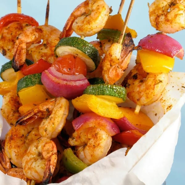 Cameron's Seafood shrimp and vegetable skewers with zucchini, bell peppers, and red onion.
